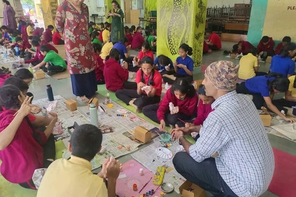 Grade VII students painting Ganpati idols