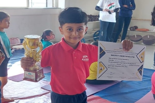 Reyansh Dahale from Std 1 won the third prize in state level yoga competition.