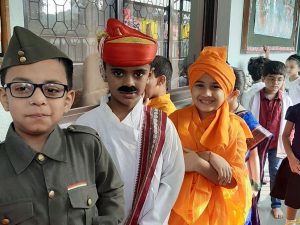 Three boys dressed for fancy dress as Indian Freedom fighters
