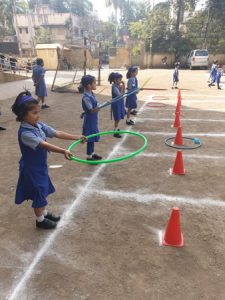 Students participating in the sports on the ground.