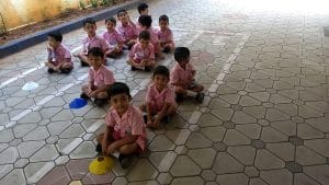 Nursery students are playing in the backyard
