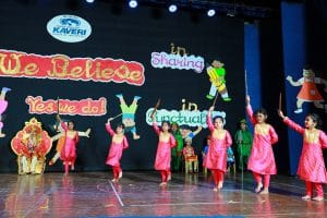 Students dancing on the stage for an event