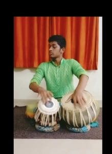 Best Junior College Pune Student practicing Tabla performance for the gathering festival.