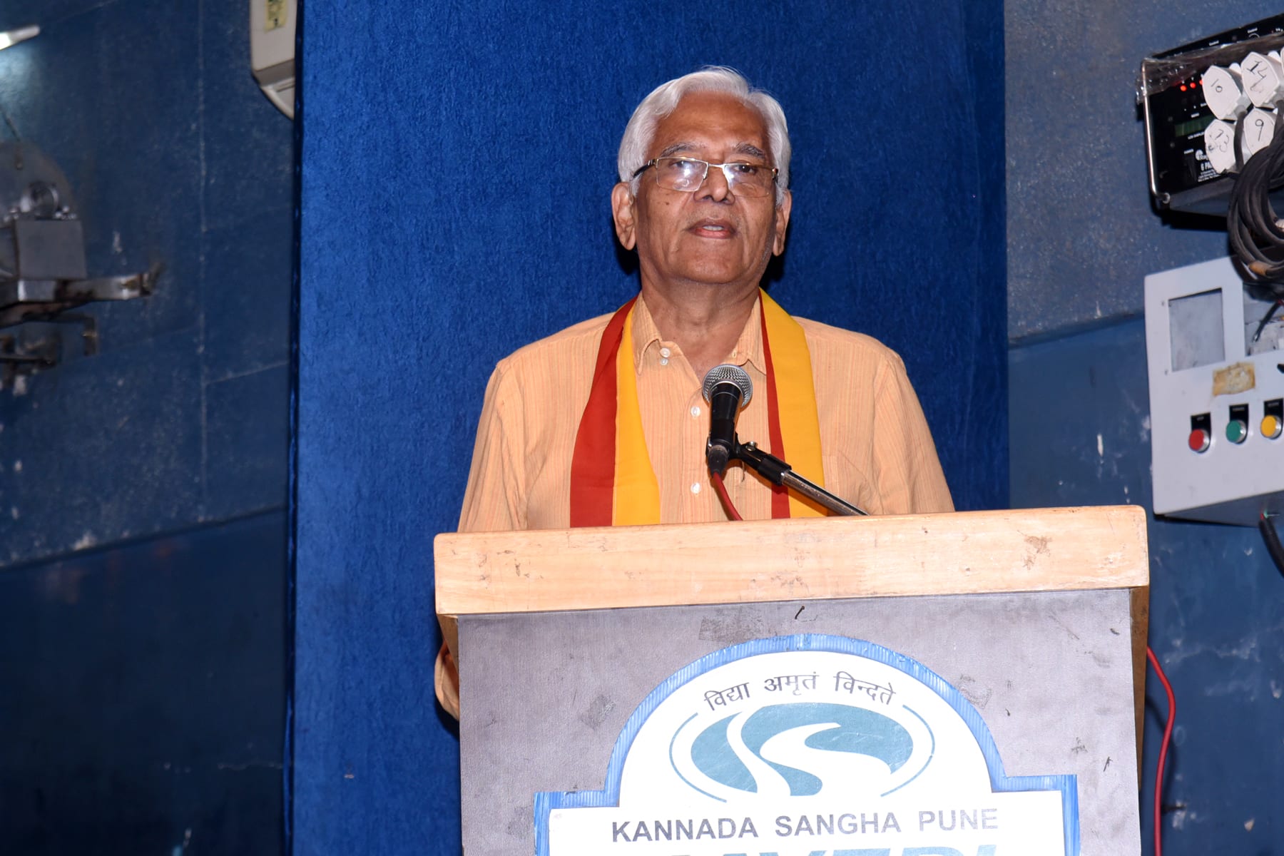 Vice President Dr. Narayan Hegde presting the poem